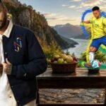 Mesa de madeira firme em paisagem com múltiplos fluxos de água e montanhas ao fundo, com Neymar ao lado, representando estabilidade financeira.